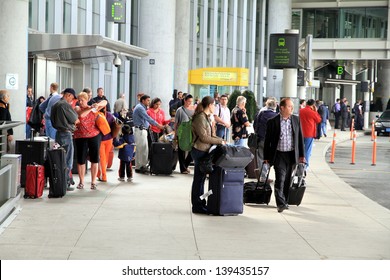 TORONTO - MAY 10: People at the Pearson Airport on May 10, 2013 in Toronto. In 2011, Toronto Pearson handled 33.4 million passengers and 428,477 aircraft movements.