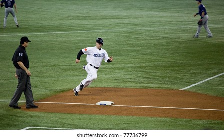 TORONTO - MAY 19: Toronto Blue Jays' Player Aaron Hill Rounds Third During A MLB Game Against The Tampa Bay Rays At Rogers Centre On May 19, 2011 In Toronto. Toronto Won 3-2.