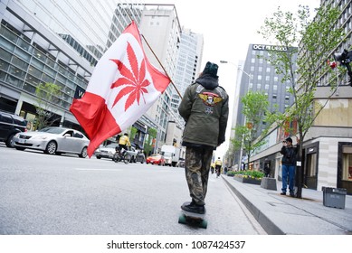 TORONTO - May 6: Supporters carrying Canadian styled flags during the Global Marijuana March 2017 in Toronto on May 6, 2017 in Toronto, Canada.

