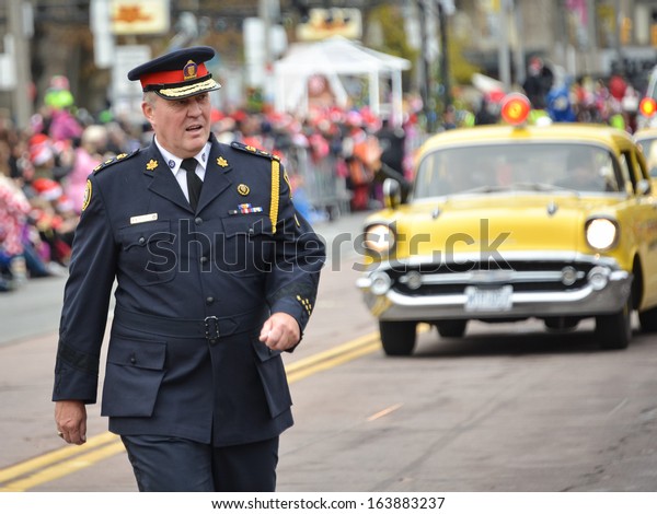 TORONTO - NOVEMBER 17: Police Chief Bill Blair\
attends 109th Toronto Santa Claus Parade in Toronto, Canada on\
November 17, 2013.