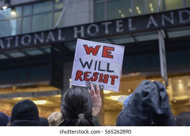 TORONTO - NOVEMBER 19: A protester with sign saying "we will resist" during a protest in front of Trump Tower on November  19, 2016 in Toronto, Canada.