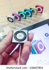 TORONTO - OCTOBER 15: Customer holds an iPod Shuffle at the Apple Store in Toronto on October 15, 2013.