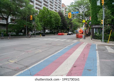 Toronto, ON Canada - June 13 2021: Progressive Transgender Pride Flag Painted On The Sidewalk At The Intersection Of Church Street And Alexander Street For LGBT Support In Toronto, Ontario Canada.