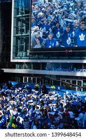 Toronto, ON/Canada - April 15, 2019: Toronto Maple Leaf Fans Cheer As They Appear On The Screen Outside Scotiabank Arena Prior To Game 3 Of The 2019 Stanley Cup Playoffs