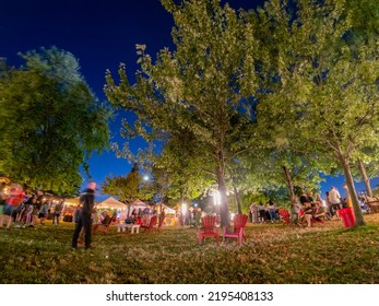 Toronto, Ontario - August 26 , 2022 : People In Motion At The Toronto Cider Festival At Night -  Inukshuk Park, Downtown Waterfront