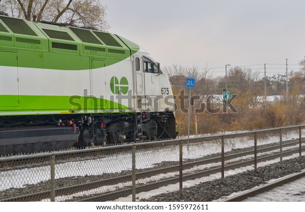 Toronto, Ontario, Canada, 2019. Go Train arriving at the\
Port Credit Station in the downtown district city. The Metrolinx\
public company is an important commuting system with TTC &\
street car system 