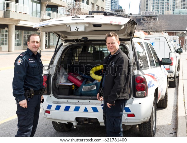 Toronto, Ontario,\
Canada - April.09.2017: Toronto Police officers preparing for work\
in Toronto, Ontario,\
Canada.