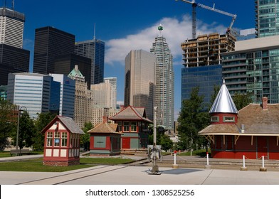 Toronto, Ontario, Canada - August 27, 2010: Historic Railway Buildings At The John Street Roundhouse Park With Toronto Skyline