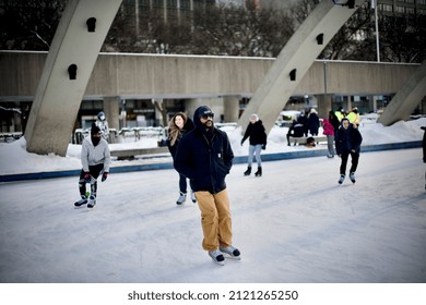 Toronto, Ontario, Canada - February 1st 20202: A Man Skating At Nathan Phillips Square.