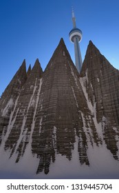 Toronto, Ontario, Canada - January 20, 2009: North Face Of Snow Covered Aluminum Mountain Sculpture In Toronto With CN Tower