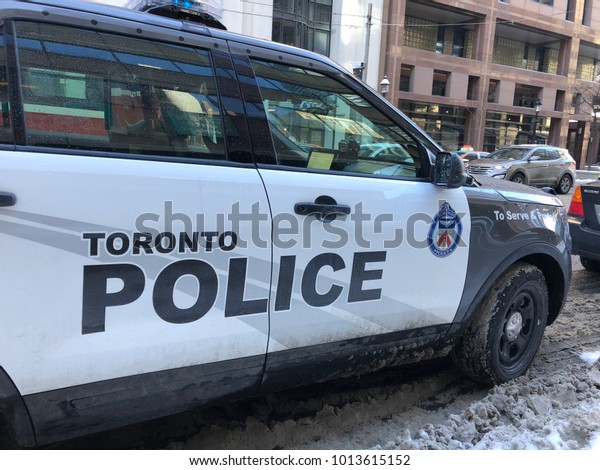 TORONTO, ONTARIO, CANADA - January 30\
2018, Police Car On Street In Winter Near Yonge and Bay Street,\
Officer Vehicle Parked On Road, Law Enforcement\
Unit