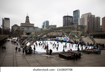 Toronto, Ontario / Canada - January 9 2016: Nathan Phillips Square Full Of People Ice Skating