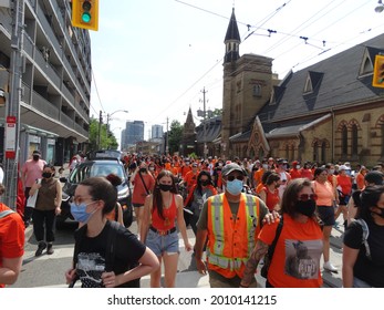 Toronto, Ontario, Canada - July 1 2021: People Walking Along Dundas St. In Solidarity With Indigenous Community Members Headed Toward Every Child Matters Event                            