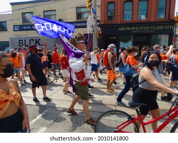 Toronto, Ontario, Canada - July 1 2021: Indigenous Man Walking On Dundas St. Headed Toward Every Child Matters Event                           