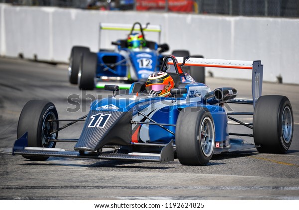 Toronto, Ontario, Canada - July 15 2018: Kory\
Enders leading Jose Sierra into Turn 8 during the USF2000 race at\
Exhibition Place