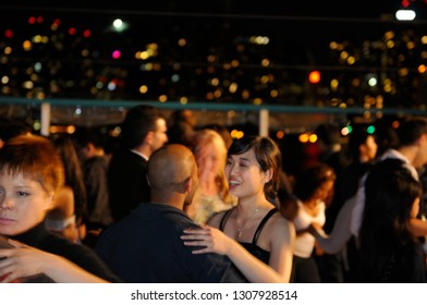 Toronto, Ontario, Canada - July 2, 2010: Young People On A Latin Dance Club Boat Cruise With Toronto Skyline Lights At Night