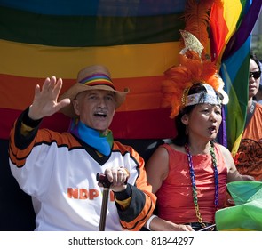 TORONTO, ONTARIO, CANADA - JULY 3:  Jack Layton And Olivia Chow At The 2011 Annual Gay Pride Parade In Toronto On July 3, 2011.