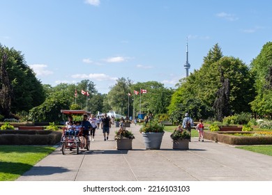 Toronto, Ontario, Canada - July 30 2021 : People Walking In The Toronto Islands Centre Island Park.