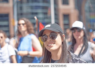 Toronto Ontario, Canada- June 25th, 2022: A Portrait Of A Lady Walking In Toronto’s Annual Dyke March. 