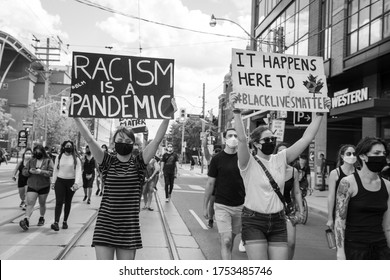 TORONTO, ONTARIO, CANADA - JUNE 6, 2020: Anti-Racism March, In Solidarity With Black Lives Matter And Against The Death Of George Floyd And Police Injustice. 

