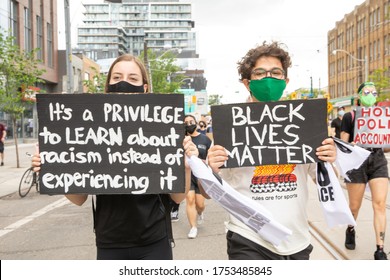 TORONTO, ONTARIO, CANADA - JUNE 6, 2020: Anti-Racism March, In Solidarity With Black Lives Matter And Against The Death Of George Floyd And Police Injustice. 

