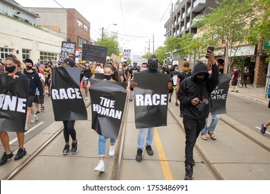 TORONTO, ONTARIO, CANADA - JUNE 6, 2020: Anti-Racism March, In Solidarity With Black Lives Matter And Against The Death Of George Floyd And Police Injustice. 