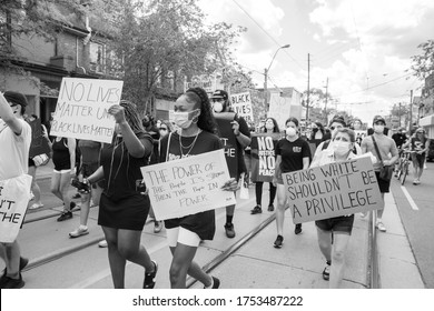 TORONTO, ONTARIO, CANADA - JUNE 6, 2020: Anti-Racism March, In Solidarity With Black Lives Matter And Against The Death Of George Floyd And Police Injustice. 