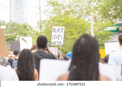 TORONTO, ONTARIO, CANADA - JUNE 6, 2020: Anti-Racism March, In Solidarity With Black Lives Matter And Against The Death Of George Floyd And Police Injustice. 