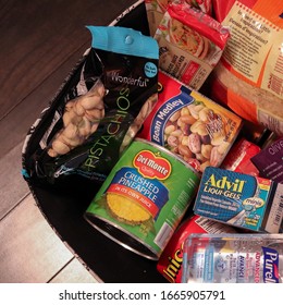 Toronto, Ontario / Canada - March 6, 2020: Emergency Preparedness / Home Quarantine Kit With Canned Food And Medical Supplies During Coronavirus Outbreak. Beans, Fruit, Rice, Advil And Purell.