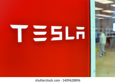 Toronto, Ontario / Canada – May 22, 2019.  Tesla Motors store sign on the building on car sales dealership in a mall.
