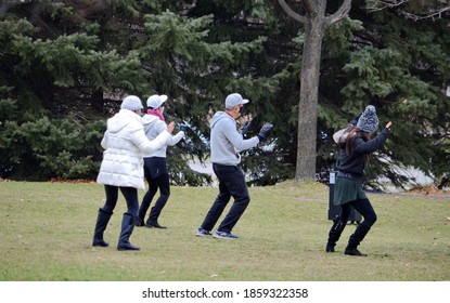 Toronto, Ontario, Canada, November 18, 2020: A Group Of People Wearing Face Masks Take Part In A Dance Exercise Class During The Coronavirus Pandemic In A Toronto City Park. 