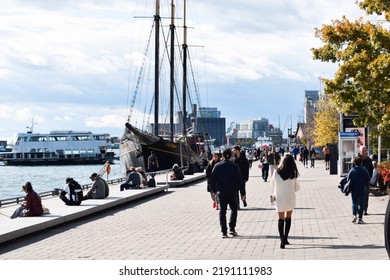 Toronto, Ontario, Canada - October 17, 2021: People Walking On Boardwalk At Harbourfront In City Downtown 