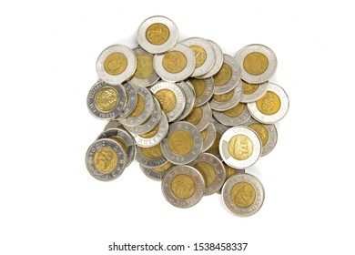 Toronto Ontario / Canada October 20 2019: Overhead View A Pile Of Canadian Two Dollar Toonie Coins Isolated On White