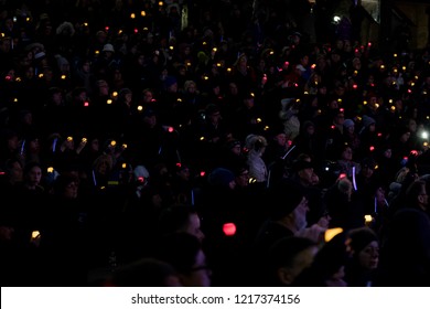 TORONTO, ONTARIO, CANADA - OCTOBER 29, 2018: People Hold Up Lit Candles At Vigil Held By Toronto Jewish Community For Victims Of Pittsburgh Synagogue Massacre