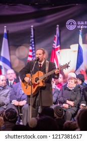 TORONTO, ONTARIO, CANADA - OCTOBER 29, 2018: Man Plays Guitar And Sings Son On Stage At Vigil Held By Toronto Jewish Community For Victims Of Pittsburgh Synagogue Massacre