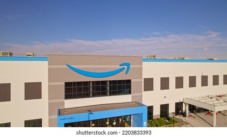 Toronto, Ontario, Canada - September 11, 2022:  Corporate Amazon Logo Brand Name And Trademark On The Office Building And Fulfillment Warehouse Entrance. Company Developed International E-commerce.