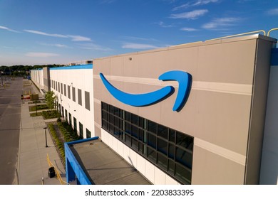 Toronto, Ontario, Canada - September 11, 2022: Amazon Logo On The New Build Modern Building. Amazon Smile Arrow Logo And Brand Trademark. Fulfillment Center Warehouse And Office Building.