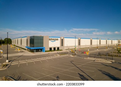 Toronto, Ontario, Canada - September 11, 2022: Aerial View Of Amazon Logo Brand Name And Trademark At Distribution Center Warehouse Entrance. Large Storage Facility And Office Headquarter.