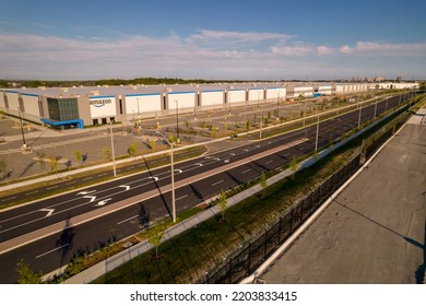 Toronto, Ontario, Canada - September 11, 2022: Amazon Logo On The New Build Modern Building. Amazon Smile Arrow Logo And Brand Trademark. Fulfillment Center Warehouse And Office Building.