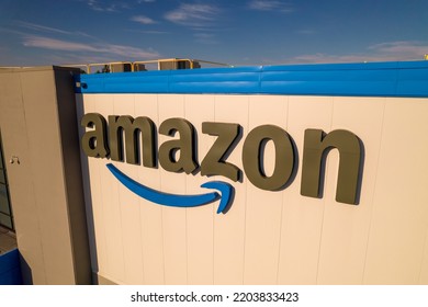 Toronto, Ontario, Canada - September 11, 2022:  Corporate Amazon Logo Brand Name And Trademark On The Office Building And Fulfillment Warehouse Entrance. Company Developed International E-commerce.