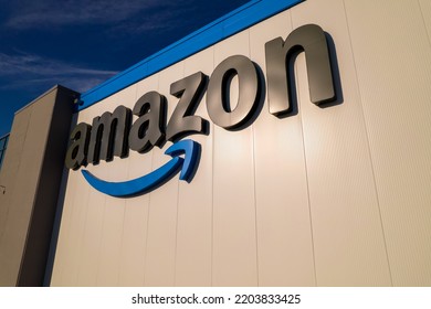 Toronto, Ontario, Canada - September 11, 2022:  Corporate Amazon Logo Brand Name And Trademark On The Office Building And Fulfillment Warehouse Entrance. Company Developed International E-commerce.