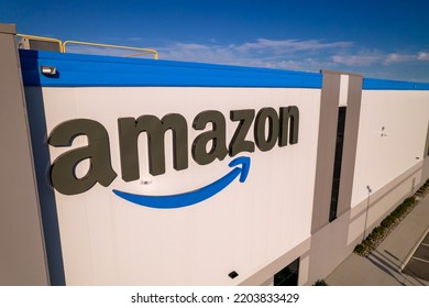 Toronto, Ontario, Canada - September 11, 2022:  Corporate Amazon Logo Brand Name And Trademark On The Office Building And Fulfillment Warehouse Entrance. Company Developed International E-commerce.