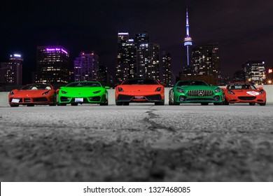 Toronto, Ontario / Canada - September 1st, 2018: Line up of exotic cars with city backdrop 