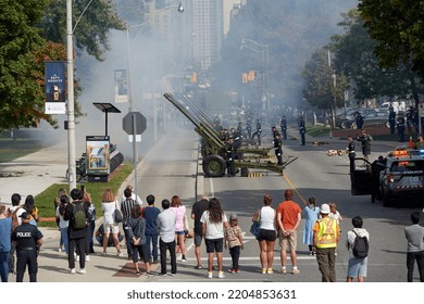 Toronto Ontario, Canada- September 20th, 2022: People Watching A Cannon Salute In Honour Of Queen Elizabeth Ii At Queens Park In Downtown Toronto.