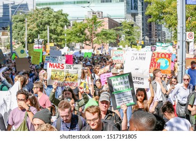 TORONTO, ONTARIO, CANADA - SEPTEMBER 27, 2019:  'Fridays for Future' climate change protest. Thousands of people march with signs at Global Climate Strike