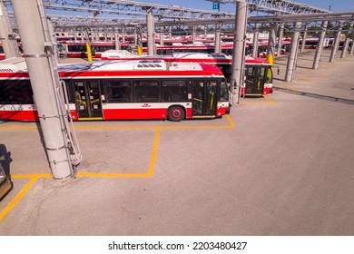 Toronto, Ontario, Canada – September 9, 2022: TTC Buses Public Transit At Maintenance Bus Bay And Bus Stop Storage Facility At Parking At Golden Hour And Long Shadows Ready To Serve City Commuters. 