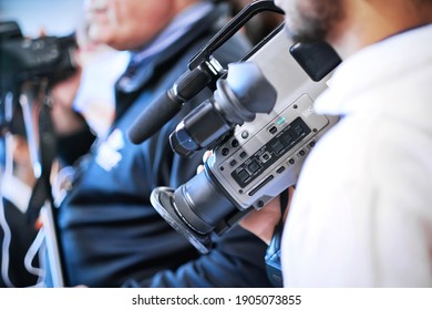 Toronto, Ontario, Canada-April 13, 2019:Journalist Reporter Man Hands Holding Digital Camcorder For Live Interview. Sport, Celebrities, Announcement, Press News Conference And Launch Event Background.