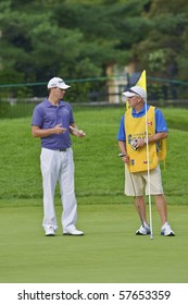 TORONTO, ONTARIO - JULY 21: U.S. Golfer John Mallinger Talking With His Caddy During A Pro-am Event At The RBC Canadian Open Golf On July 21, 2010 In Toronto, Ontario.