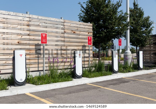 TORONTO,\
ONTARIO - July 26, 2019: Tesla Urban Supercharger Stations empty at\
CF Sherway Gardens Mall in Toronto,\
Ontario.