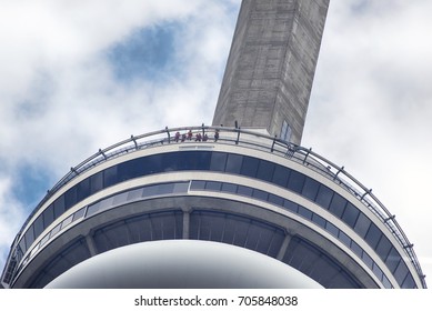 TORONTO, ONTARIO - July 27, 2017 Group Of People Participating In The CN Tower Edge Walk In Toronto.